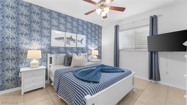 bedroom with ceiling fan and light tile patterned floors