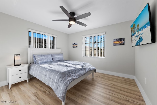 bedroom featuring light wood-type flooring and ceiling fan