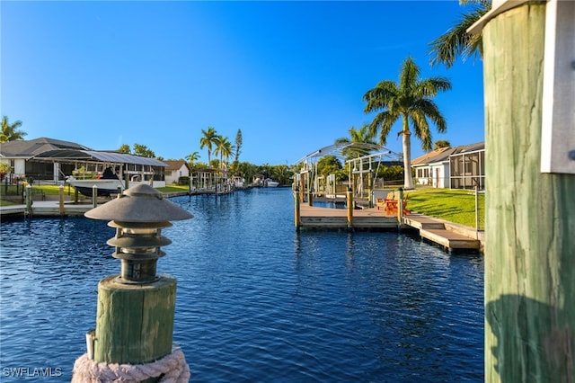 property view of water with a dock