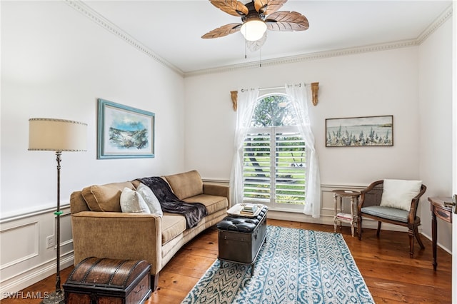 living room featuring wood-type flooring, plenty of natural light, ornamental molding, and ceiling fan