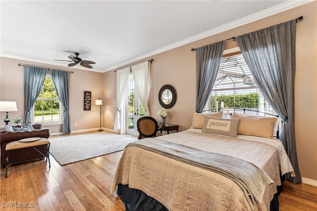 bedroom with ornamental molding, ceiling fan, and hardwood / wood-style floors