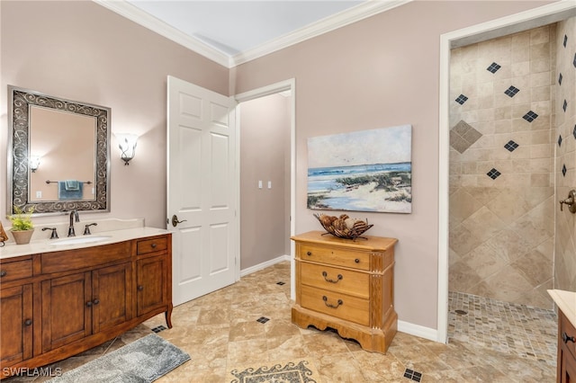 bathroom featuring ornamental molding, vanity, and a tile shower