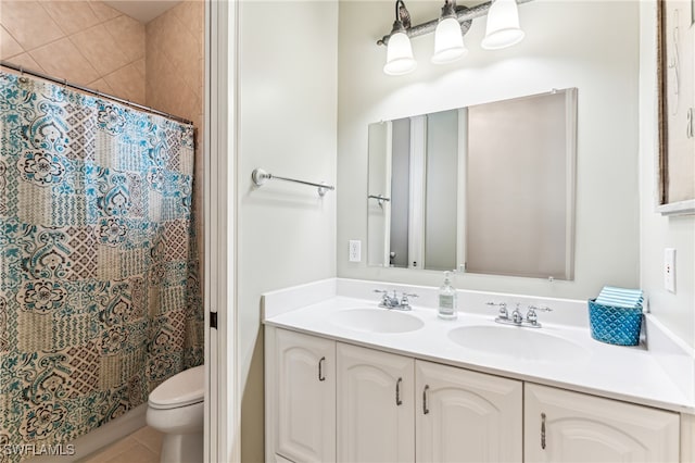 bathroom with walk in shower, vanity, toilet, and tile patterned floors