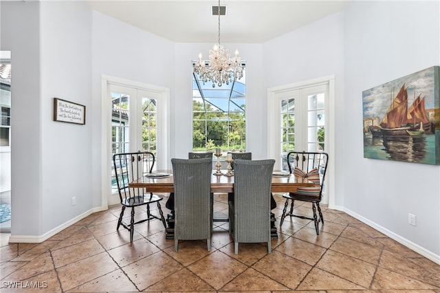 dining room featuring french doors and a notable chandelier