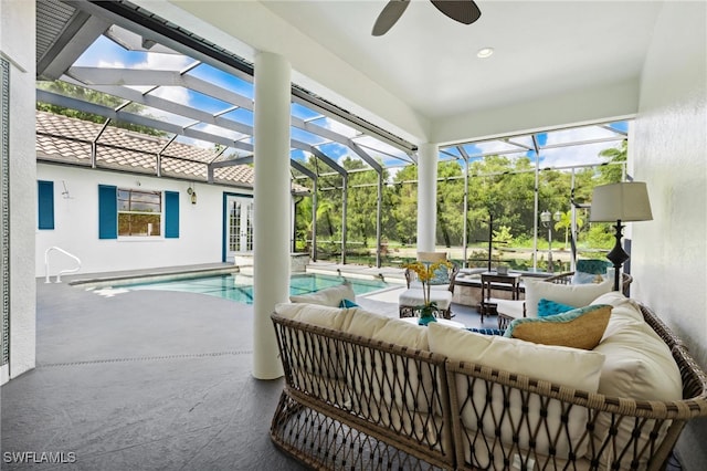 exterior space with ceiling fan and a swimming pool