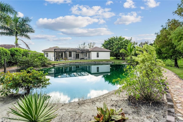 exterior space featuring a water view and a lanai