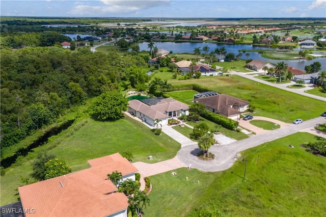 birds eye view of property with a water view