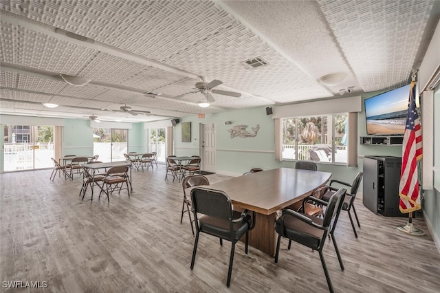 dining room featuring ceiling fan and wood-type flooring