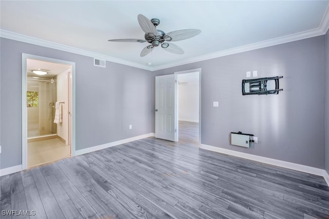 unfurnished bedroom with crown molding, dark wood-type flooring, and ceiling fan