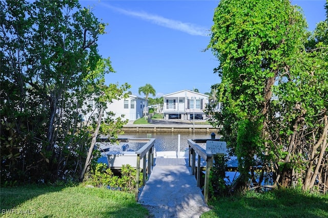 view of front of home with a water view