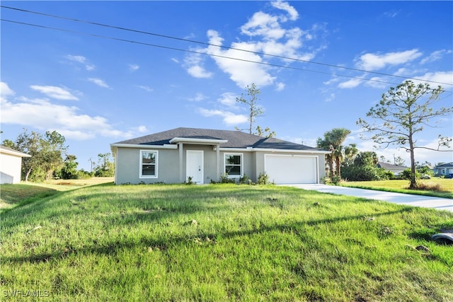 view of front of house with a front lawn and a garage