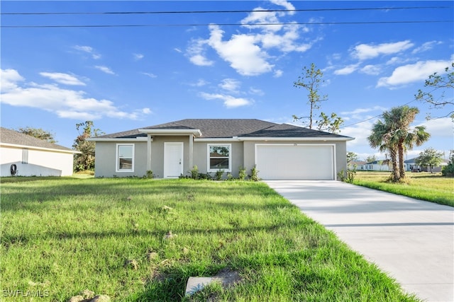 view of front of house with a garage and a front lawn