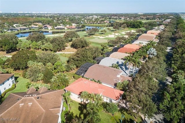 aerial view featuring view of golf course, a water view, and a residential view