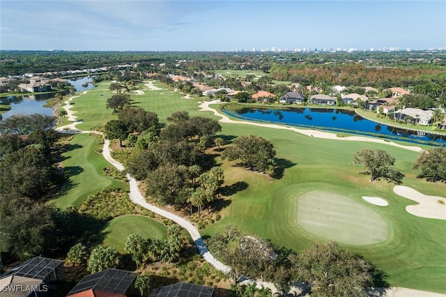 aerial view featuring golf course view and a water view