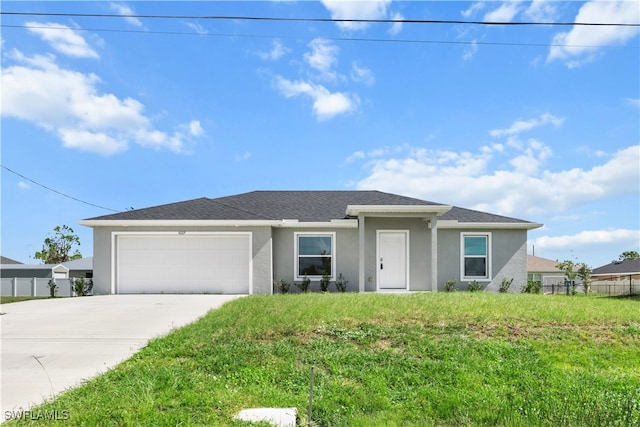 single story home featuring a front yard and a garage