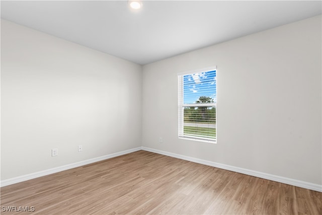 spare room with light hardwood / wood-style floors