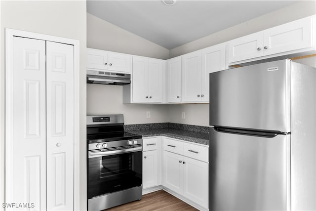 kitchen featuring white cabinetry, appliances with stainless steel finishes, vaulted ceiling, and dark hardwood / wood-style flooring