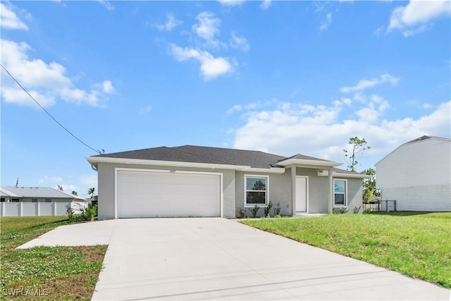 ranch-style house featuring a front lawn and a garage