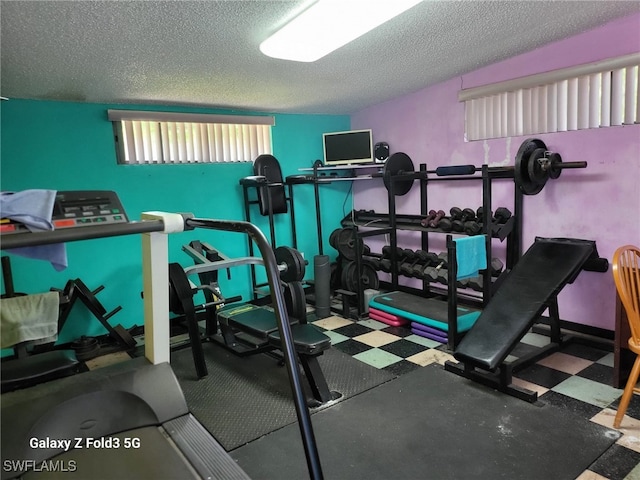 workout area with a textured ceiling