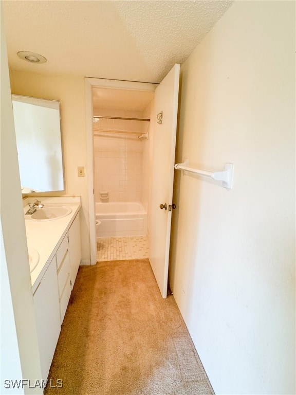 full bathroom featuring vanity, toilet, a textured ceiling, and bathing tub / shower combination