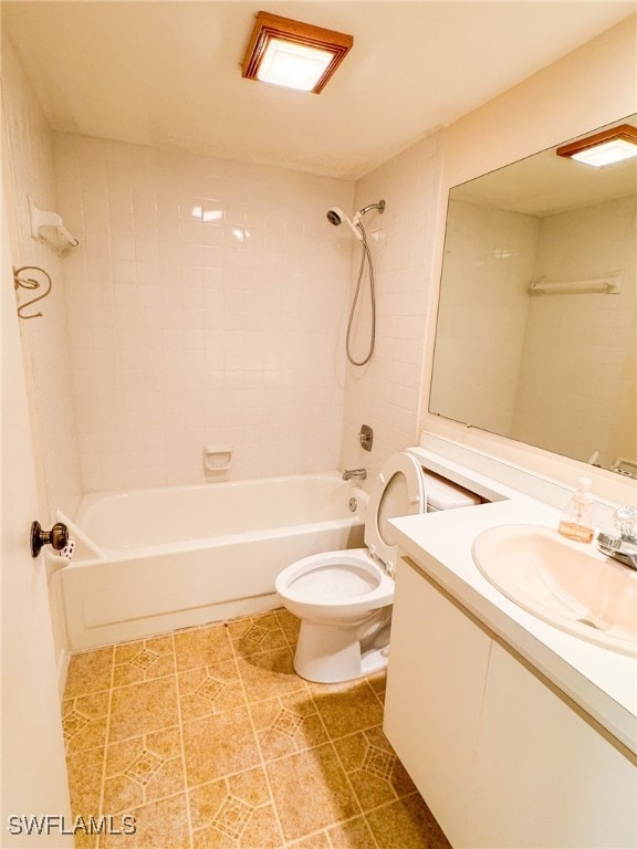 full bathroom with vanity, toilet, and tiled shower / bath