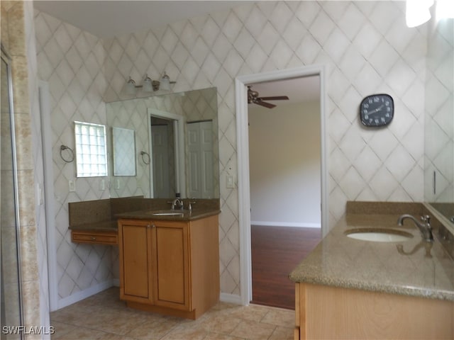 bathroom with ceiling fan, hardwood / wood-style flooring, and vanity