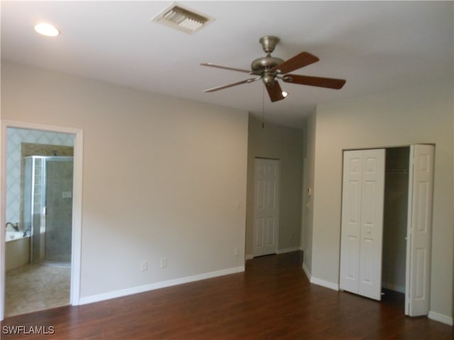 unfurnished bedroom with connected bathroom, ceiling fan, and dark hardwood / wood-style flooring