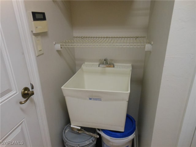 bathroom featuring sink and toilet