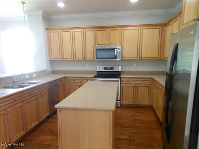 kitchen featuring appliances with stainless steel finishes, dark wood-type flooring, crown molding, a center island, and sink