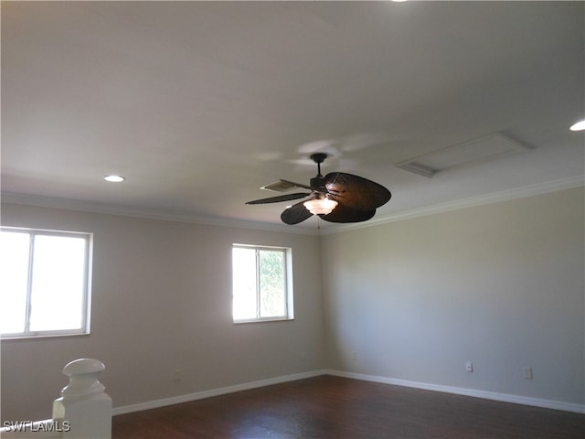 empty room with ceiling fan, crown molding, and dark hardwood / wood-style flooring