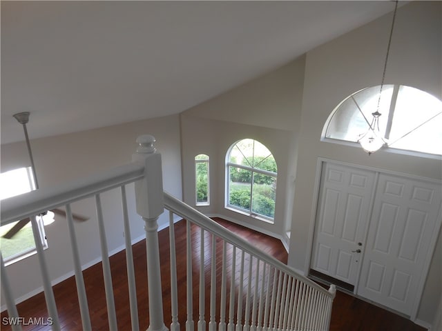 entrance foyer featuring a notable chandelier and dark wood-type flooring