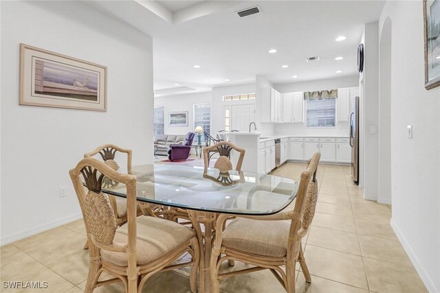 dining space featuring light tile patterned floors, recessed lighting, and baseboards