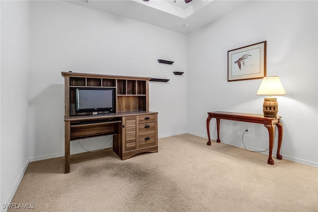 office with baseboards, a ceiling fan, and light colored carpet