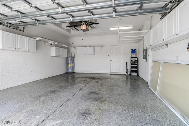 garage featuring water heater, a garage door opener, and electric panel