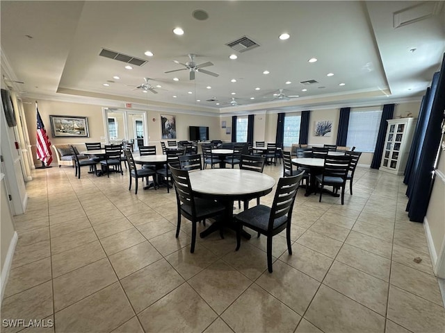 dining area with a raised ceiling, crown molding, ceiling fan, plenty of natural light, and recessed lighting