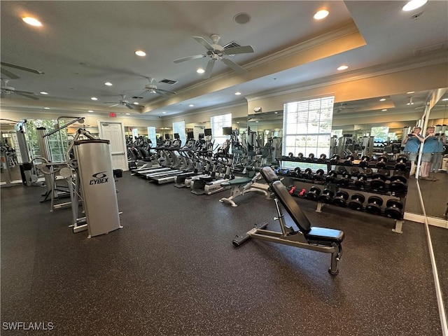 exercise room with crown molding, a tray ceiling, a ceiling fan, and recessed lighting