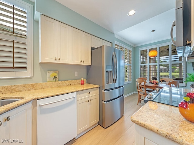 kitchen with pendant lighting, white dishwasher, white cabinets, light hardwood / wood-style flooring, and stainless steel refrigerator with ice dispenser