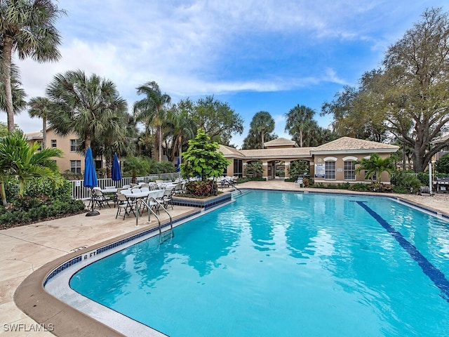 view of swimming pool featuring a patio