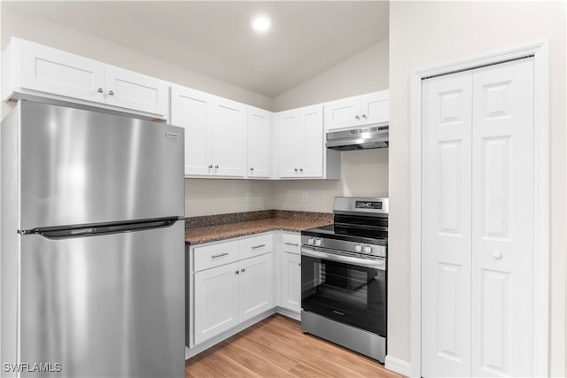 kitchen with light hardwood / wood-style floors, appliances with stainless steel finishes, lofted ceiling, and white cabinets