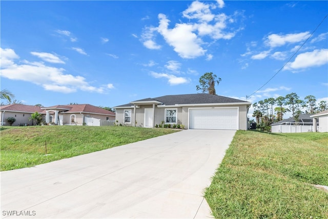 view of front of property with a front yard and a garage