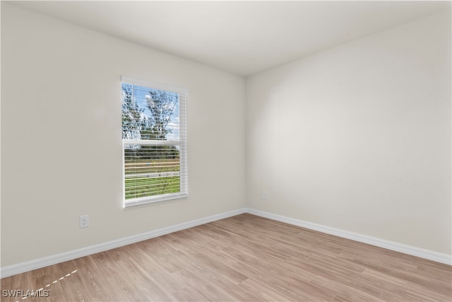 spare room with light wood-type flooring