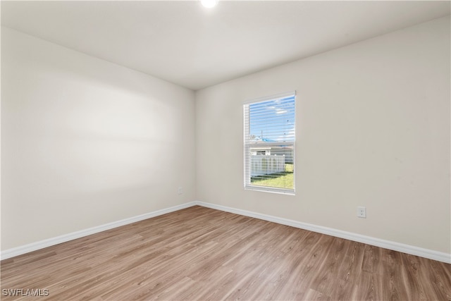 spare room featuring light hardwood / wood-style flooring