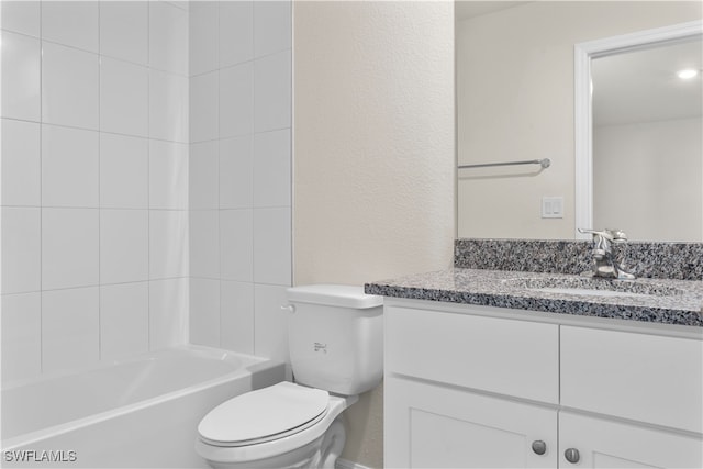 full bathroom with vanity, toilet, and  shower combination