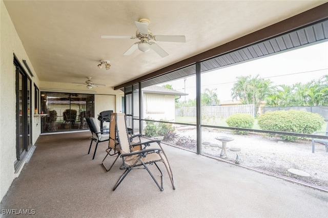 sunroom / solarium with ceiling fan