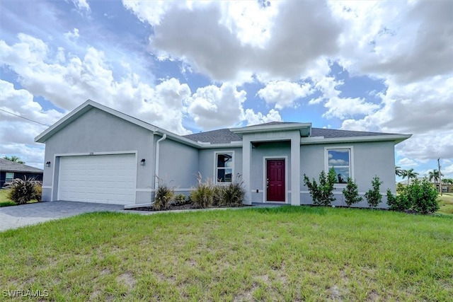 view of front facade featuring a garage and a front yard