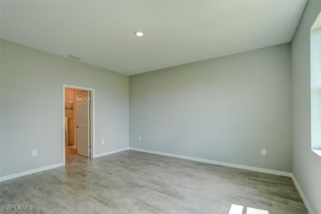 unfurnished room with light hardwood / wood-style flooring