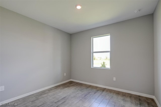 unfurnished room featuring light hardwood / wood-style floors