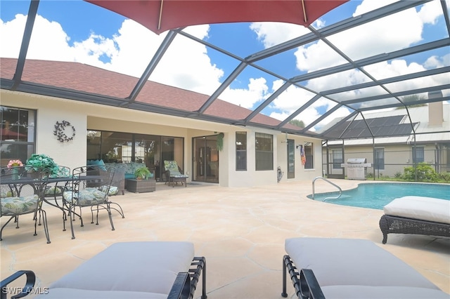 view of pool featuring a patio, area for grilling, and a lanai