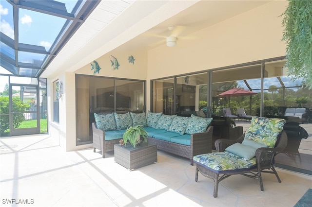 view of patio / terrace featuring a lanai, an outdoor living space, and ceiling fan