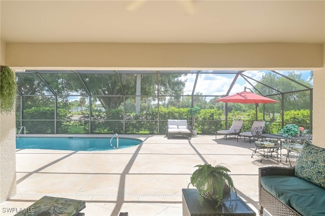 view of swimming pool with a patio and glass enclosure